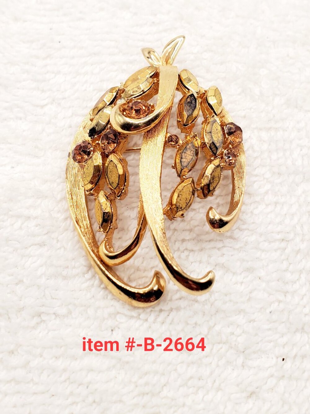 1 Vintage gold tone B.S.K brooch, item # B- 2664,. wt. 17 grams.